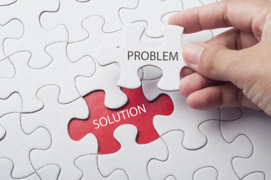 A jigsaw puzzle with the words ‘Problem and ‘Solution’