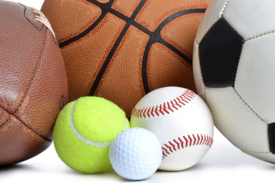 Close up of different sports balls