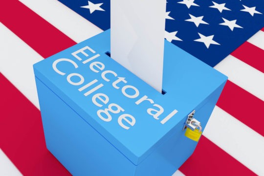 Cartoon of ballot box that reads “Electoral College” sitting on top of American flag