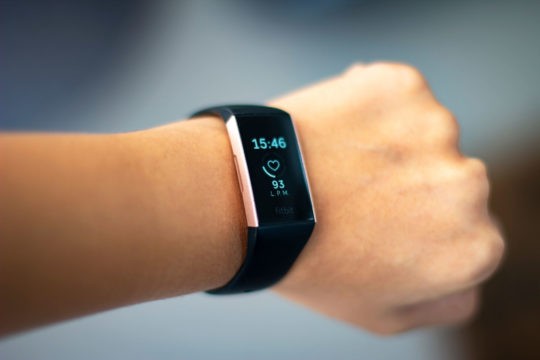 Close up of a Fitbit on a woman’s wrist
